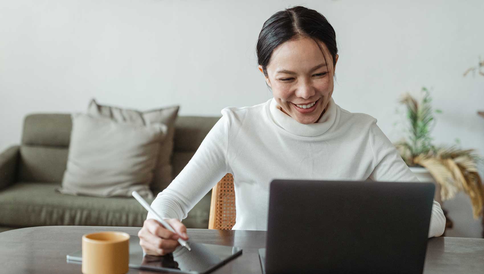 happy woman on laptop