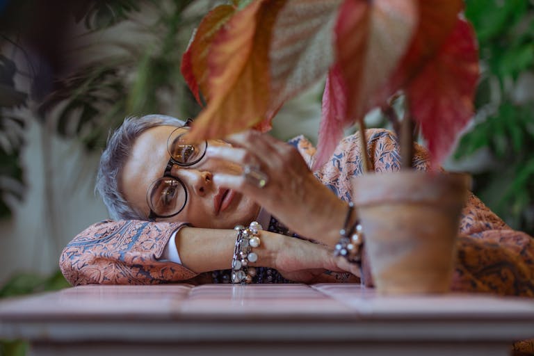 Photo Of Woman Leaning Her Head On Table